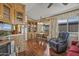 Cozy dining room featuring a wooden table set, built-in cabinets, and ample natural light at 17200 W Bell Rd # 624, Surprise, AZ 85374