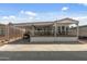 Home exterior featuring a covered carport and patio at 17200 W Bell Rd # 624, Surprise, AZ 85374