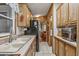 Well-organized kitchen featuring light wood cabinetry and modern appliances, creating a functional space at 17200 W Bell Rd # 624, Surprise, AZ 85374