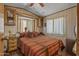 Inviting main bedroom with a queen bed, side tables, and cozy decor at 17200 W Bell Rd # 624, Surprise, AZ 85374