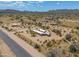 Aerial view of a desert property with a single-story home and spacious lot at 192 S Ralston Rd, Maricopa, AZ 85139