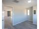 Bedroom with door leading to another room and neutral walls at 192 S Ralston Rd, Maricopa, AZ 85139