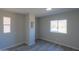 Bright bedroom with window, wood-look flooring, and neutral walls at 192 S Ralston Rd, Maricopa, AZ 85139