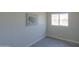 Bedroom featuring a US map print and large window at 192 S Ralston Rd, Maricopa, AZ 85139