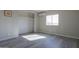 Bedroom with large closet, window, and wood-look flooring at 192 S Ralston Rd, Maricopa, AZ 85139