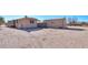 View of the house and adjacent shed in the desert at 192 S Ralston Rd, Maricopa, AZ 85139