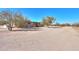 Tan colored house with desert landscape and AC units at 192 S Ralston Rd, Maricopa, AZ 85139