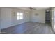 Living room with gray flooring and white doors at 192 S Ralston Rd, Maricopa, AZ 85139