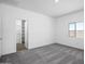 Cozy bedroom features a window and plush carpet and closet at 24567 W Alta Vista Rd, Buckeye, AZ 85326