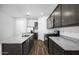 Modern kitchen with granite counters, stainless appliances, wood flooring, and ample cabinet space at 24567 W Alta Vista Rd, Buckeye, AZ 85326