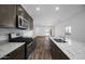 Bright kitchen features granite counters, a gas range, stainless appliances, and an open layout at 24567 W Alta Vista Rd, Buckeye, AZ 85326