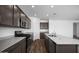 Well-equipped kitchen with granite countertops, stainless appliances, and ample cabinet space at 24668 W Alta Vista Rd, Buckeye, AZ 85326