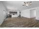 Spacious open-concept with kitchen and living space, and wood-look flooring at 24668 W Alta Vista Rd, Buckeye, AZ 85326