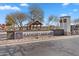 Rancho Mirage entrance sign with stone accents, landscaping, and a covered gazebo in the background at 37535 W Padilla St, Maricopa, AZ 85138