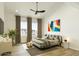 Modern bedroom showcasing a stylish bed, contemporary artwork, and a cozy area rug, perfect for relaxation at 8055 E Thomas Rd # E117, Scottsdale, AZ 85251