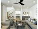 Bright living room with modern furnishings, stairs, and an open view to the kitchen at 8055 E Thomas Rd # E117, Scottsdale, AZ 85251