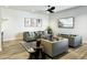 Contemporary living room featuring modern furnishings, neutral tones, and a sleek ceiling fan at 8055 E Thomas Rd # E117, Scottsdale, AZ 85251