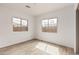 Bright bedroom features wood-look flooring and two well-lit windows at 4735 W Stargazer Pl, Laveen, AZ 85339