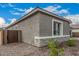 The exterior of this home showcases stone accents and a private, gated entrance at 4735 W Stargazer Pl, Laveen, AZ 85339