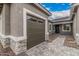 Attached two-car garage with a paver driveway and a pathway to the front door at 4735 W Stargazer Pl, Laveen, AZ 85339