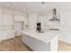 Spacious kitchen with white cabinets, stainless steel appliances, and a large center island at 4735 W Stargazer Pl, Laveen, AZ 85339