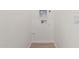 A functional laundry room with wood look tile and all the hookups at 4735 W Stargazer Pl, Laveen, AZ 85339