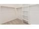 Spacious walk-in closet with shelving and hanging rods for organization at 4735 W Stargazer Pl, Laveen, AZ 85339