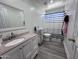 Clean bathroom with a shower/tub combo and vanity at 6245 W Southgate St, Phoenix, AZ 85043