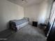 Simple bedroom with a twin bed and nightstand at 6245 W Southgate St, Phoenix, AZ 85043