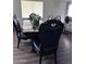 Elegant dining room with dark wood table and six chairs at 6245 W Southgate St, Phoenix, AZ 85043