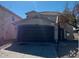 Two-story house with a brown garage door and basketball hoop at 6245 W Southgate St, Phoenix, AZ 85043