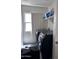 Laundry room with washer, dryer, and overhead shelving at 6245 W Southgate St, Phoenix, AZ 85043