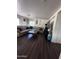 Bright living room with L-shaped sectional sofa and coffee table at 6245 W Southgate St, Phoenix, AZ 85043