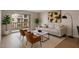 Cozy living room showcasing neutral decor, a balcony, and plenty of natural light at 7930 E Camelback Rd # 506, Scottsdale, AZ 85251