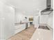 Modern kitchen features sleek white cabinets, stainless steel appliances, and an open layout at 7113 E Mcdonald Dr, Paradise Valley, AZ 85253