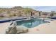 Image of desert home's pool with adjacent rock landscaping at 18315 W Santa Alberta Ln, Goodyear, AZ 85338