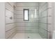 Luxurious tiled shower with a glass enclosure, enhancing the spa-like ambiance of this bathroom at 6901 E Restin Rd, Carefree, AZ 85377