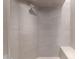 Shower featuring a tiled wall and bench, with an accent shower head at 6901 E Restin Rd, Carefree, AZ 85377