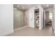 Modern bathroom features frameless glass shower and built-in shelving at 6901 E Restin Rd, Carefree, AZ 85377