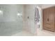 Bright bathroom featuring a glass enclosed shower and custom storage cabinets at 6901 E Restin Rd, Carefree, AZ 85377