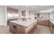Kitchen area showcasing a marble countertop island, stainless steel refrigerator, and modern cabinets at 6901 E Restin Rd, Carefree, AZ 85377