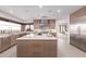 Spacious kitchen with a center island, stainless steel appliances, and a stunning desert view at 6901 E Restin Rd, Carefree, AZ 85377