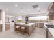Modern kitchen features an island with seating and a large window with desert views at 6901 E Restin Rd, Carefree, AZ 85377