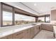 Modern kitchen with sleek countertops and gorgeous desert view at 6901 E Restin Rd, Carefree, AZ 85377