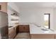 Modern kitchenette with stainless steel appliances, light wood cabinets, and a view at 6901 E Restin Rd, Carefree, AZ 85377