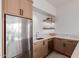 Kitchenette featuring stainless appliances and floating shelves at 6901 E Restin Rd, Carefree, AZ 85377