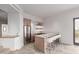 Stylish kitchenette with bar seating, modern appliances, and light wood cabinets at 6901 E Restin Rd, Carefree, AZ 85377