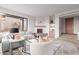 Bright living room with a stone fireplace, comfortable seating, and natural light at 6901 E Restin Rd, Carefree, AZ 85377