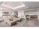 Open-concept living room featuring modern furnishings, and views into the kitchen and bar areas at 6901 E Restin Rd, Carefree, AZ 85377
