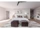 Spacious main bedroom with hardwood floors, modern ceiling fan, and neutral tones at 6901 E Restin Rd, Carefree, AZ 85377